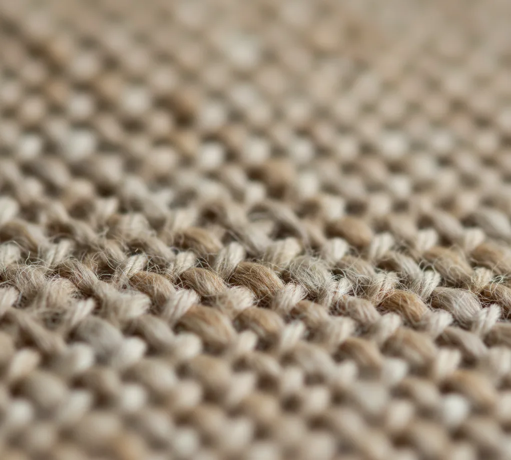 Artisan weaving on traditional loom